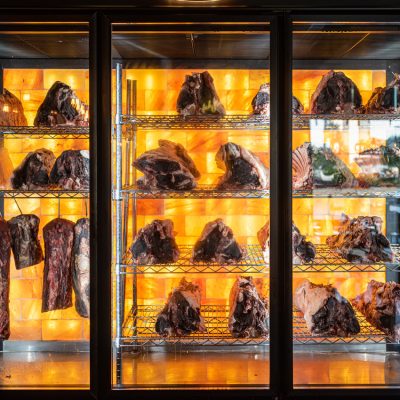 Beef hung and lined up in a dry aged beef cabinet